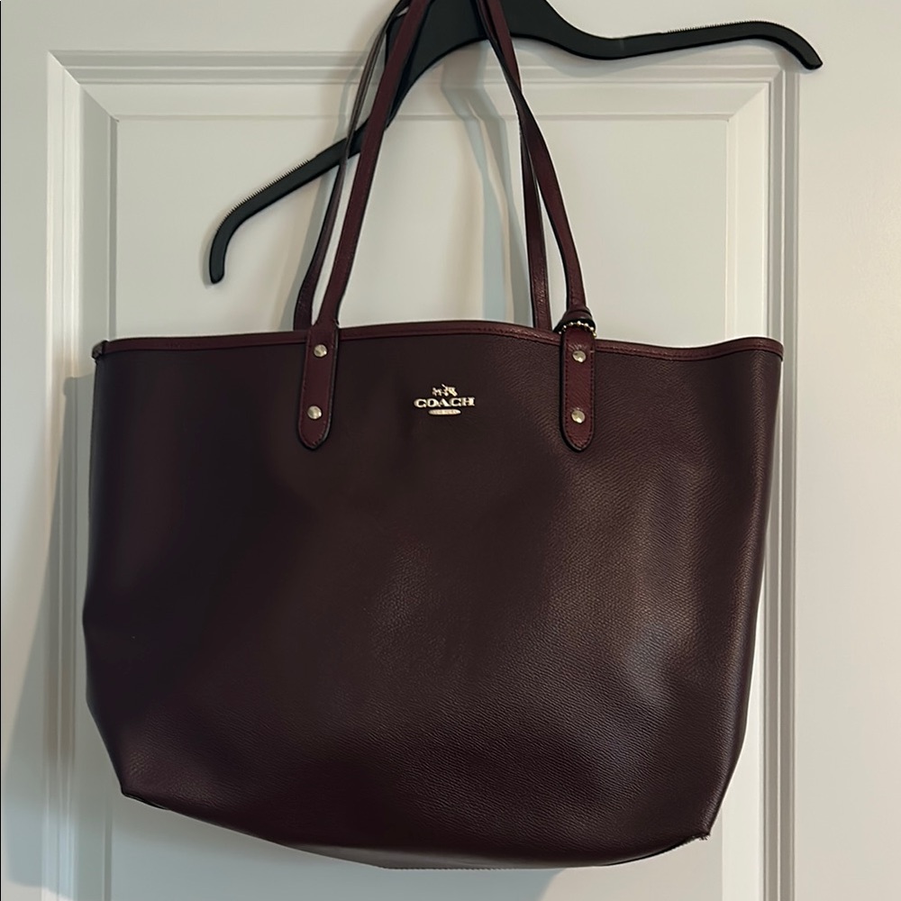 Coach Dark Burgundy Leather Tote. Color is burgundy-